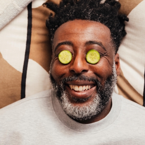 Man being greeted at the door